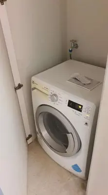 a washing machine in a corner of a room at sky suite klcc in Kuala Lumpur