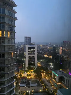 a view of a city at night with buildings at sky suite klcc in Kuala Lumpur