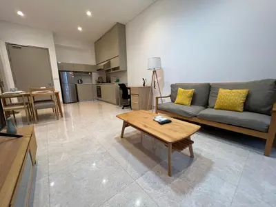 a living room with a couch and a table at Lucentia Residence At Kuala Lumpur By Dreamcloud in Kuala Lumpur