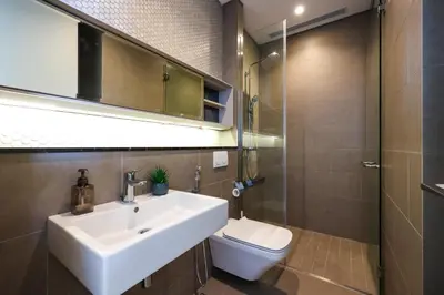 a bathroom with a sink and a toilet at Lucentia Residence At Kuala Lumpur By Dreamcloud in Kuala Lumpur