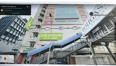 a large building with a staircase in front of it at SCC Gateway Chinatown Hotel in Kuala Lumpur