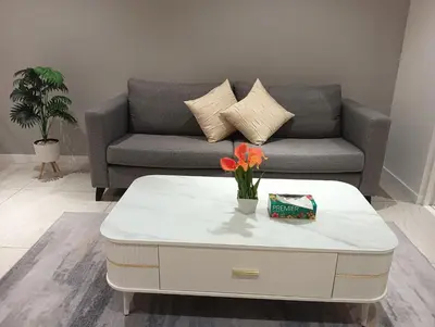 a living room with a couch and a coffee table at Quill Residence KLCC in Kuala Lumpur