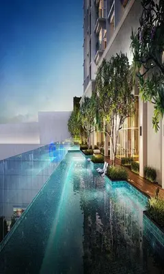 a swimming pool in front of a building at Quill Residence KLCC in Kuala Lumpur