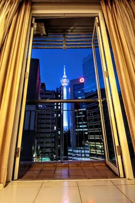 a view of a city skyline from a window at Electus Suite in Kuala Lumpur