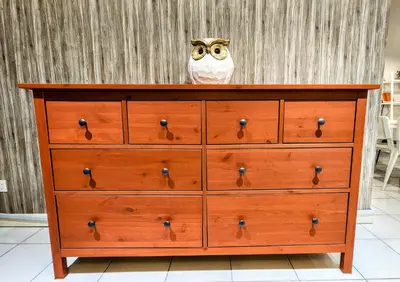 a dresser with an owl sitting on top of it at Electus Suite in Kuala Lumpur