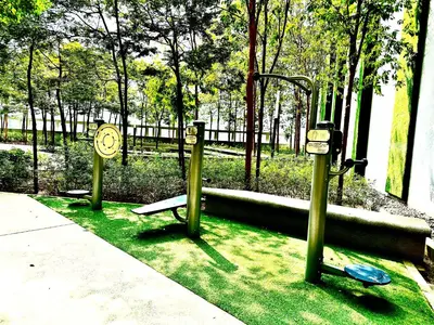 three parking meters in a park with a bench at Robertson Bukit Bintang with Netflix,TRX,KLCC in Kuala Lumpur