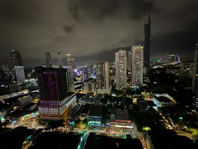 a city lit up at night with buildings at One Bukit ceylon @ Bukit Bintang City Centre in Kuala Lumpur
