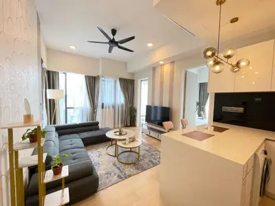 a living room with a couch and a table at Klcc suites at star - 2 bedroom in Kuala Lumpur
