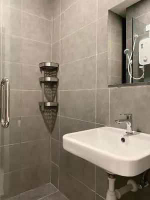 a bathroom with a sink and a mirror at Neu Suites by JS Home in Kuala Lumpur