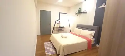 a small bedroom with a white bed and a mirror at COZY TWO BEDROOM APARTMENT AT MERCU SUMMER in Kuala Lumpur