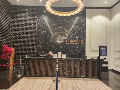 a chandelier hanging over a dance floor in a building at Chambers Suites KL BY Fortune in Kuala Lumpur
