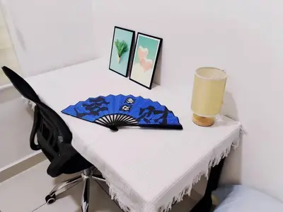 a desk with a table with a chair and a glass at PWTC Titiwangsa HKL near MRT family in Kuala Lumpur