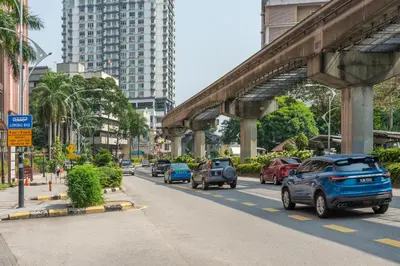 a city street with cars driving down a road at STAYS HOTEL in Kuala Lumpur