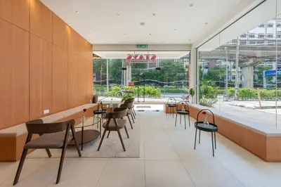 a restaurant with tables and chairs in a building at STAYS HOTEL in Kuala Lumpur