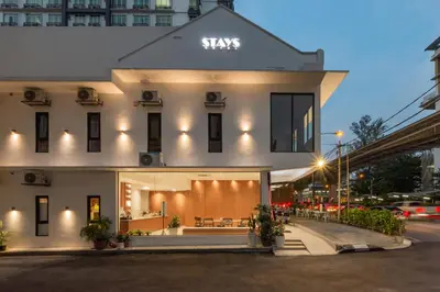 a white building with a sign on the front of it at STAYS HOTEL in Kuala Lumpur