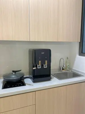 a kitchen counter with a stove and a pan on it at LOVELy Home For Small Family@KL in Kuala Lumpur