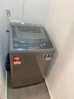 a toaster oven sitting in the corner of a room at LOVELy Home For Small Family@KL in Kuala Lumpur