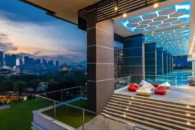 a balcony of a building with a view of a city at Lavile Premier Suite Cheras 5 - 6 pax 3R2B in Kuala Lumpur
