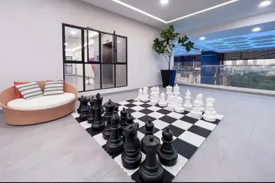 a living room with a chess board and a couch at Lavile Premier Suite Cheras 5 - 6 pax 3R2B in Kuala Lumpur