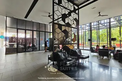 a lobby with people sitting in chairs in a building at Expressionz Premium Suites @ KLCC in Kuala Lumpur