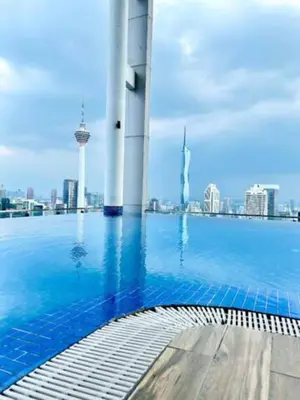 a swimming pool with a view of the city at Maxhome at The Luxe By Infinitum in Kuala Lumpur