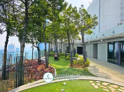 a garden in front of a building with trees at The Robertson Bukit Bintang Kuala Lumpur by Cloud Host in Kuala Lumpur