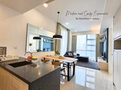 a kitchen and a living room with a kitchen and a table at The Robertson Bukit Bintang Kuala Lumpur by Cloud Host in Kuala Lumpur