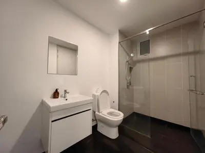 a bathroom with a toilet and a sink and a shower at Una Serviced Apartment, Jalan Peel by Rverse Suite in Kuala Lumpur