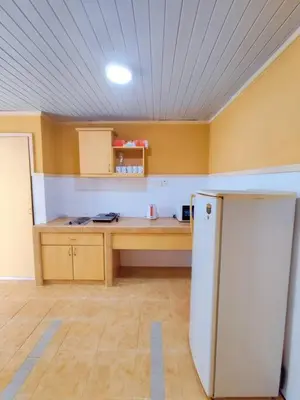 a kitchen with a white refrigerator in a room at Fahrenheit Pavillion Bukit Bintang By JS-Home in Kuala Lumpur