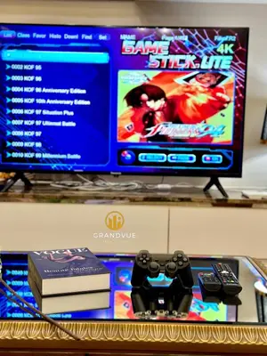 a computer monitor and a video game controller on a table at Dorsett Residence Bukit Bintang 3MinsTo Pavilion By HeyStay Management in Kuala Lumpur