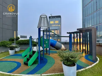 a playground in front of a building with a slide at Dorsett Residence Bukit Bintang 3MinsTo Pavilion By HeyStay Management in Kuala Lumpur