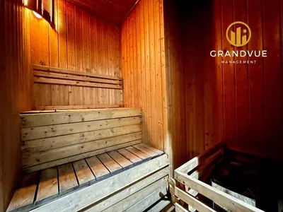a wooden sauna with a wooden floor and red walls at Dorsett Residence Bukit Bintang 3MinsTo Pavilion By HeyStay Management in Kuala Lumpur