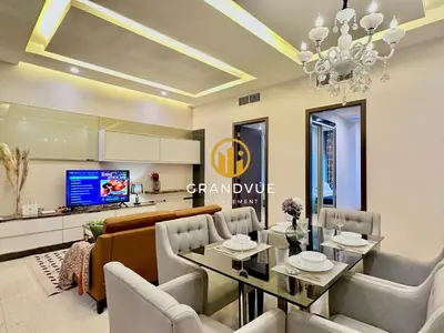 a living room with a dining table and a tv at Dorsett Residence Bukit Bintang 3MinsTo Pavilion By HeyStay Management in Kuala Lumpur