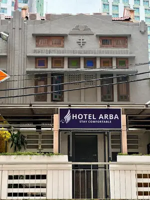 a hotel area with a sign in front of a building at Hotel Arba in Kuala Lumpur
