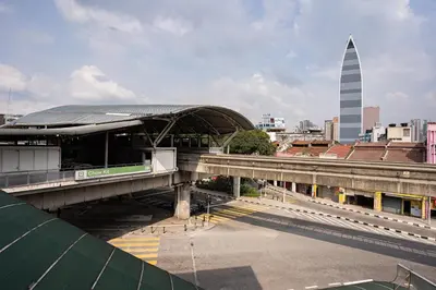 a bridge over a city with a tower in the background at HOTEL 28 RAPID in Kuala Lumpur