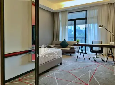 a living room with a couch and a table at Maison 101 Dang Wangi Kuala Lumpur KLCC in Kuala Lumpur