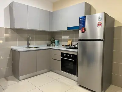 a kitchen with a stainless steel refrigerator and a sink at KL City View 2R1B Free Wifi 6pax in Kuala Lumpur