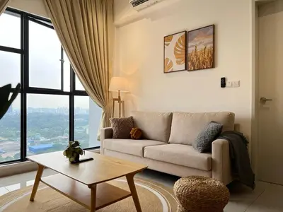 a living room with a couch and a table at KL City View 2R1B Free Wifi 6pax in Kuala Lumpur