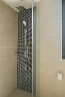 a shower with a shower head in a bathroom at Ooak Residence in Mont Kiara, Kuala Lumpur in Kuala Lumpur