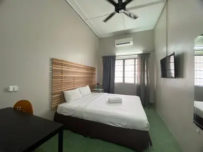 a bedroom with a bed and a ceiling fan at Cheras homestay @kelian in Kuala Lumpur