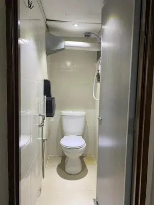 a small bathroom with a toilet and a shower at Cheras homestay @kelian in Kuala Lumpur