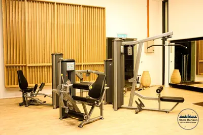 a gym with cardio equipment and treadmills at Lucentia Residence by EAS Maju property in Kuala Lumpur
