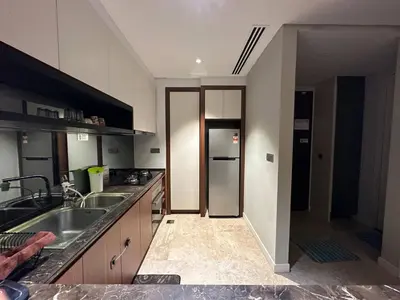 a kitchen with a sink and a refrigerator at Luxurious Condo in Heart of Kuala Lumpur with Rooftop Garden in Kuala Lumpur