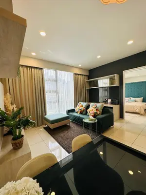 a living room with a couch and a table at The Robertson Residence KL Bukit Bintang Chinatown Jalan Alor by \u54c1\u5c4b PINWU Shortstay in Kuala Lumpur