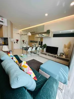 a living room with a blue couch and a living room at The Robertson Residence KL Bukit Bintang Chinatown Jalan Alor by \u54c1\u5c4b PINWU Shortstay in Kuala Lumpur