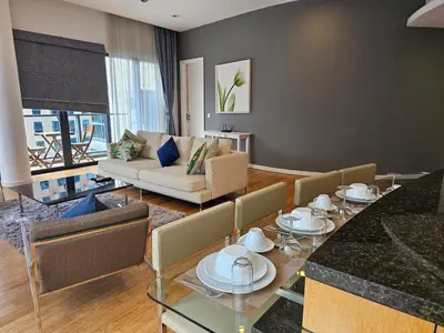 a living room with a table and a couch at Stylish Large 3guests 1br St Mary Residences in Kuala Lumpur