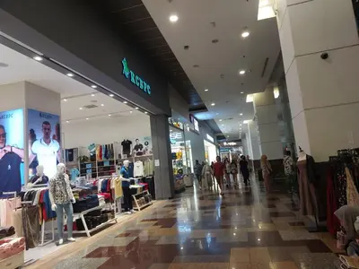 a store with people walking in a shopping mall at DOUBLE DELUXE APARTMENT AT BERJAYA TIMES SQUARE kL in Kuala Lumpur