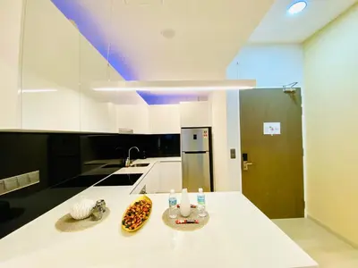 a kitchen with a white counter top and a sink at Star residence by KLCC in Kuala Lumpur