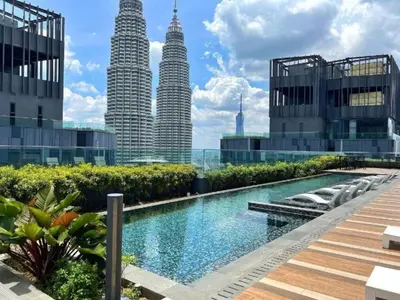 a view of the petronas twin towers from the city at Star residence by KLCC in Kuala Lumpur