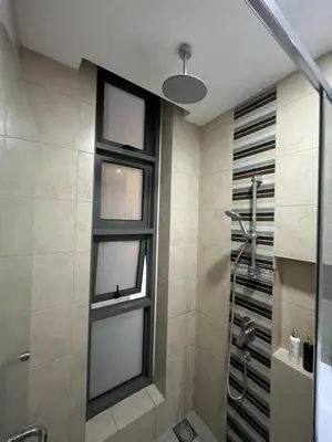 a bathroom with a shower and a window at 1 Room 1 Bathroom The Robertson KLCC in Kuala Lumpur